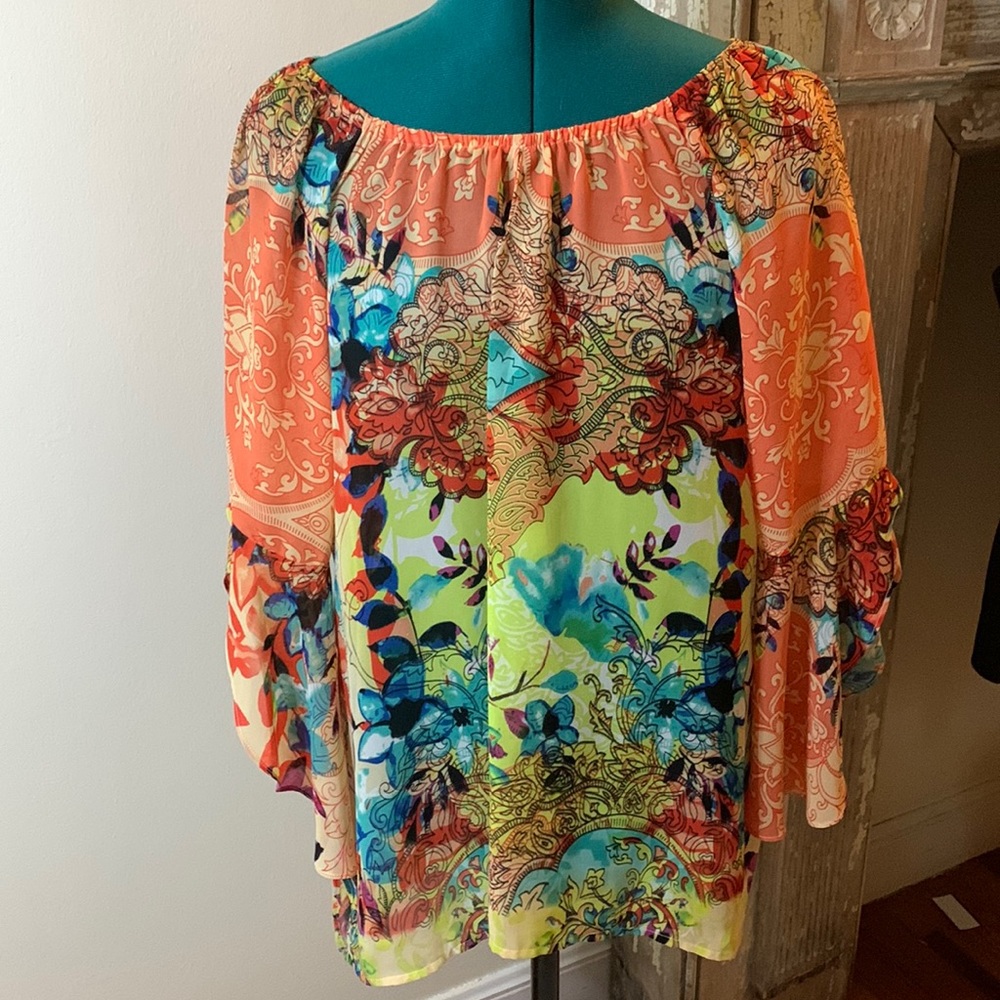 Colorful sheer top.